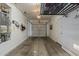 Spacious garage featuring storage racks, water heater, and clean concrete flooring at 2540 N 148Th Dr, Goodyear, AZ 85395
