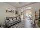 Charming living room featuring gray sofas and an open view to the patio at 2540 N 148Th Dr, Goodyear, AZ 85395