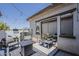 Relaxing patio with comfortable seating, contemporary decor, and seamless indoor-outdoor flow at 2540 N 148Th Dr, Goodyear, AZ 85395