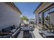 Cozy patio area with stylish outdoor furniture, decorative lighting, and a relaxing atmosphere at 2540 N 148Th Dr, Goodyear, AZ 85395