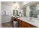 Bright bathroom featuring double sinks, granite countertop and a glass-enclosed shower at 2635 N El Dorado Pl, Chandler, AZ 85224