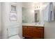 Well lit bathroom showcasing a vanity with white countertop and traditional wood cabinet at 2635 N El Dorado Pl, Chandler, AZ 85224