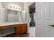 Bathroom featuring a sink and mirror with modern lighting at 2635 N El Dorado Pl, Chandler, AZ 85224