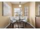 Cozy breakfast nook features table, chairs, and window view at 2635 N El Dorado Pl, Chandler, AZ 85224