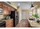 Updated kitchen featuring granite countertops, wood cabinets, and stainless steel appliances at 2635 N El Dorado Pl, Chandler, AZ 85224