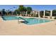Community pool with lounge chairs and greenery along perimeter at 2635 N El Dorado Pl, Chandler, AZ 85224