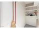 Utility storage closet with shelving, great for storing cleaning supplies or other household items at 2635 N El Dorado Pl, Chandler, AZ 85224
