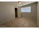 Bedroom with a closet, window, and tile flooring at 2745 E Wood St, Phoenix, AZ 85040