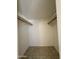 Bedroom closet with rods and tile flooring at 2745 E Wood St, Phoenix, AZ 85040