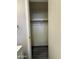 Walk-in closet with a rod for hanging clothes and storage, with wood-look floors at 2745 E Wood St, Phoenix, AZ 85040