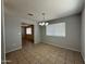 A traditional dining room featuring neutral walls, tile floor and bright natural light at 2745 E Wood St, Phoenix, AZ 85040