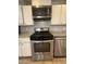 A modern kitchen with stainless steel appliances including an oven, microwave and dishwasher at 2745 E Wood St, Phoenix, AZ 85040