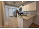 Modern kitchen featuring granite countertops and stainless steel appliances at 2745 E Wood St, Phoenix, AZ 85040