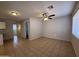 View of the living room with a ceiling fan and natural light at 2745 E Wood St, Phoenix, AZ 85040