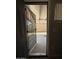 A secure screen door gives access to an outdoor patio at 2745 E Wood St, Phoenix, AZ 85040