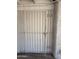 Durable white metal security gate offering safety and privacy to the property at 2745 E Wood St, Phoenix, AZ 85040