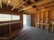 Interior of a shed showcasing built-in shelving and worktables with space for storage at 2745 E Wood St, Phoenix, AZ 85040