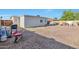 Backyard with gravel and wheelbarrow at 2823 W Banff Ln, Phoenix, AZ 85053