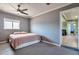 Bedroom with a ceiling fan, neutral paint, and natural light at 2823 W Banff Ln, Phoenix, AZ 85053
