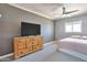Bedroom with a ceiling fan, neutral paint, and natural light at 2823 W Banff Ln, Phoenix, AZ 85053