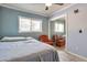 Bedroom with tile floors, crown molding, and a mirrored closet at 2823 W Banff Ln, Phoenix, AZ 85053