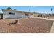 Exterior shot of the home showcasing the desert landscaping and covered porch at 2823 W Banff Ln, Phoenix, AZ 85053