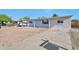 Exterior view featuring the front of the home, desert landscaping, and concrete driveway at 2823 W Banff Ln, Phoenix, AZ 85053
