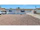 Charming single-story home featuring a low-maintenance front yard with rock landscaping and a covered entry at 2823 W Banff Ln, Phoenix, AZ 85053