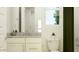Bathroom features a single sink vanity, granite countertop, and toilet at 3009 N 97Th Dr, Phoenix, AZ 85037