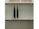 Organized closet with shelves and hanging rods, offering ample space for clothing and storage solutions at 3009 N 97Th Dr, Phoenix, AZ 85037