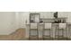 Stylish kitchen featuring an island with seating, stainless steel appliances, and modern finishes at 3009 N 97Th Dr, Phoenix, AZ 85037