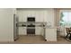 Modern kitchen with stainless steel appliances, granite countertops, and ample cabinet space at 3009 N 97Th Dr, Phoenix, AZ 85037