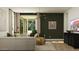 Bright and spacious living room with hardwood floors, modern decor, and sliding glass doors at 3009 N 97Th Dr, Phoenix, AZ 85037