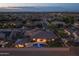 Aerial view showcasing a home with a private pool, outdoor living area, and landscaped surroundings in a residential neighborhood at 3119 E Bellflower Dr, Gilbert, AZ 85298