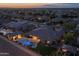 Aerial view capturing a home with a private pool, outdoor area, and beautiful landscaping in a residential neighborhood at 3119 E Bellflower Dr, Gilbert, AZ 85298