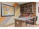 Basement bar area with a popcorn machine and wine rack at 3119 E Bellflower Dr, Gilbert, AZ 85298