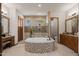 Luxurious primary bathroom boasts a large tub and a walk-in shower with decorative tile surround at 3119 E Bellflower Dr, Gilbert, AZ 85298