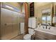 Bathroom with a tub and frosted glass doors at 3119 E Bellflower Dr, Gilbert, AZ 85298