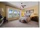 Sunny bedroom with neutral walls features large windows and plush carpeting at 3119 E Bellflower Dr, Gilbert, AZ 85298