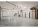 Clean garage with epoxy floors and storage cabinets for organization and functionality at 3119 E Bellflower Dr, Gilbert, AZ 85298