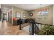 Upstairs landing space with railing, built-in desk and light-filled window at 3119 E Bellflower Dr, Gilbert, AZ 85298