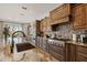 Well-appointed kitchen showcasing custom cabinetry, a mosaic backsplash, and a copper sink at 3119 E Bellflower Dr, Gilbert, AZ 85298