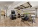 Living room with beamed ceiling, fireplace, and travertine floors at 3119 E Bellflower Dr, Gilbert, AZ 85298