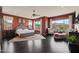 Spacious main bedroom with dark hardwood floors and scenic backyard views at 3119 E Bellflower Dr, Gilbert, AZ 85298