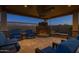 Inviting outdoor fireplace with stone surround and seating, perfect for relaxing evenings in a cozy atmosphere at 3119 E Bellflower Dr, Gilbert, AZ 85298