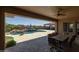 Covered outdoor patio offers shade and beautiful backyard views of the sparkling pool and cabana at 3119 E Bellflower Dr, Gilbert, AZ 85298