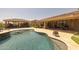 Beautiful pool with a swim-up bar and a covered outdoor kitchen, ideal for entertaining guests at 3119 E Bellflower Dr, Gilbert, AZ 85298