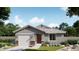 Charming single-story home with stone accents, attached garage, and beautifully landscaped front yard at 32016 N Pony Express Rd, San Tan Valley, AZ 85143
