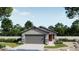 Charming single-story home with gray siding, stone accents, red front door, and two car garage at 32254 N Pony Express Rd, San Tan Valley, AZ 85143