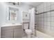 Bathroom features single sink vanity, toilet, tub and shower combo at 3408 N 69Th Dr, Phoenix, AZ 85033